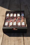 Carton of peaches in plastic packaging with 'Fruit of the Loom' labels.